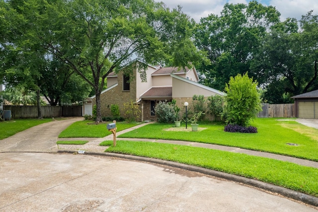 518 Lorie Ln, Pasadena, TX 77586 - mid-century home featuring brick siding, driveway, and a garage