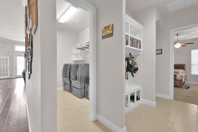 9103 Lacombe Ln, Tomball, TX 77375 - hall with separate washer and dryer and baseboards