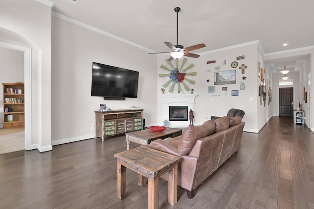 9103 Lacombe Ln, Tomball, TX 77375 - living room featuring dark wood finished floors, ceiling fan, crown molding, a fireplace, and baseboards