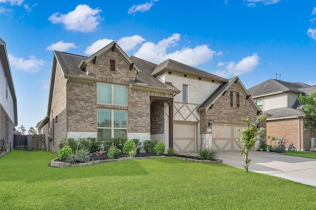 9103 Lacombe Ln, Tomball, TX 77375 - view of front facade featuring driveway, brick siding, stone siding, and a shingled roof