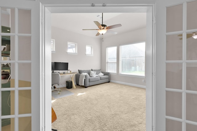9103 Lacombe Ln, Tomball, TX 77375 - carpeted living area with a desk, ceiling fan, and baseboards