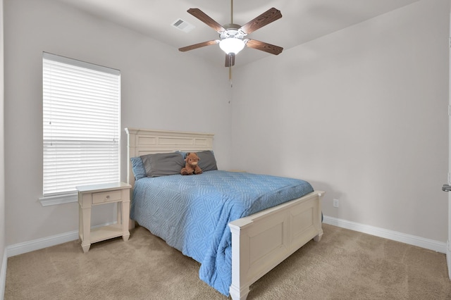 9103 Lacombe Ln, Tomball, TX 77375 - bedroom featuring light colored carpet, baseboards, and a ceiling fan
