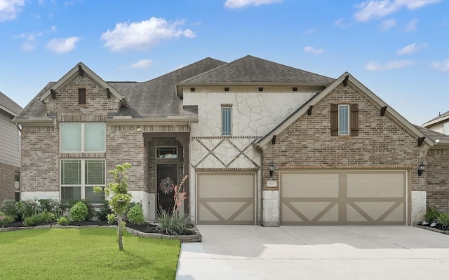9103 Lacombe Ln, Tomball, TX 77375 - view of front of house featuring brick siding, roof with shingles, concrete driveway, and a front yard