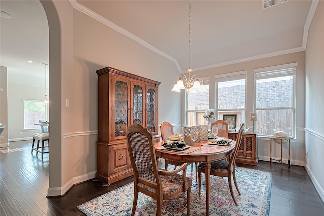 10147 Deerpark Dr, Missouri City, TX 77459 - dining room with dark wood finished floors, baseboards, a chandelier, arched walkways, and crown molding