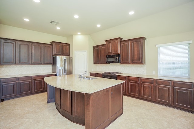 14110 Green Thicket Dr, Pearland, TX 77584 - kitchen with appliances with stainless steel finishes, a sink, light stone counters, backsplash, and recessed lighting