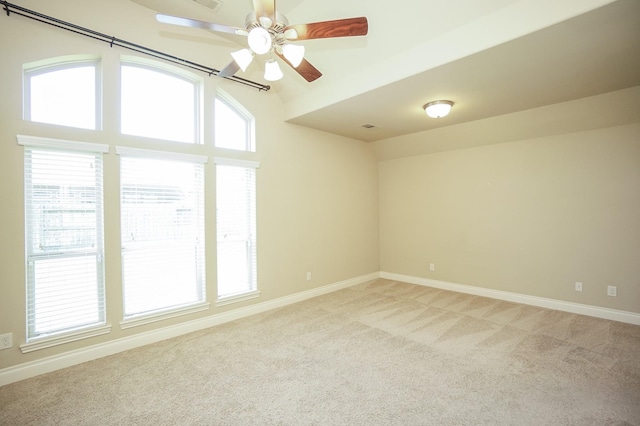 14110 Green Thicket Dr, Pearland, TX 77584 - unfurnished room with light carpet, baseboards, ceiling fan, and vaulted ceiling