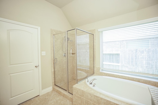14110 Green Thicket Dr, Pearland, TX 77584 - bathroom featuring a bath, a shower stall, tile patterned floors, and lofted ceiling
