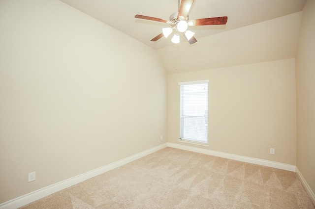 14110 Green Thicket Dr, Pearland, TX 77584 - empty room with baseboards, light colored carpet, vaulted ceiling, and ceiling fan