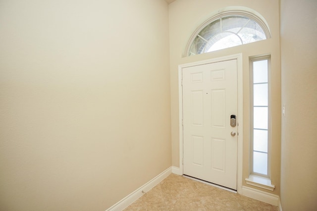 14110 Green Thicket Dr, Pearland, TX 77584 - entryway featuring baseboards and light tile patterned flooring