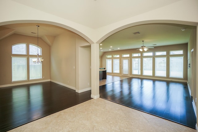 14110 Green Thicket Dr, Pearland, TX 77584 - tiled empty room with a ceiling fan, a chandelier, baseboards, recessed lighting, and lofted ceiling