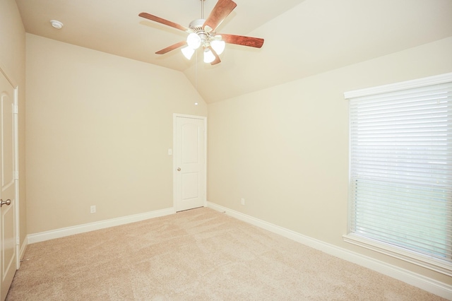14110 Green Thicket Dr, Pearland, TX 77584 - unfurnished bedroom with light colored carpet, vaulted ceiling, baseboards, and ceiling fan