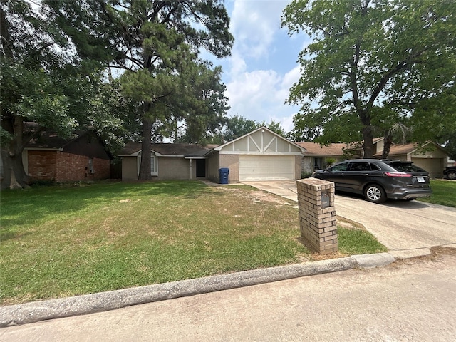 4111 Fitzwater Dr, Spring, TX 77373 - view of front of house featuring an attached garage, concrete driveway, and a front lawn