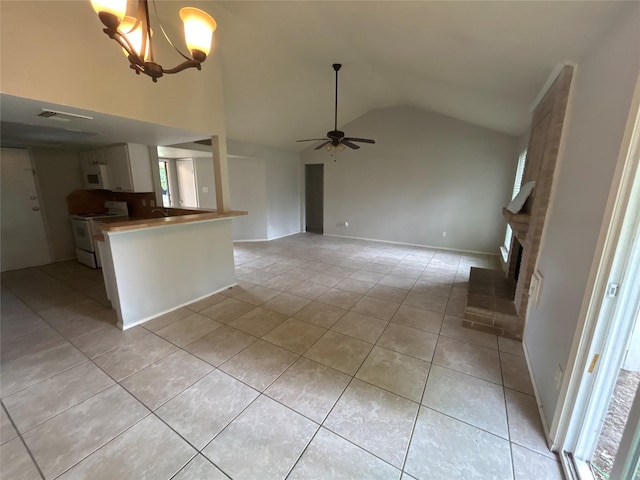 4111 Fitzwater Dr, Spring, TX 77373 - kitchen featuring white appliances, light tile patterned floors, a ceiling fan, a brick fireplace, and high vaulted ceiling