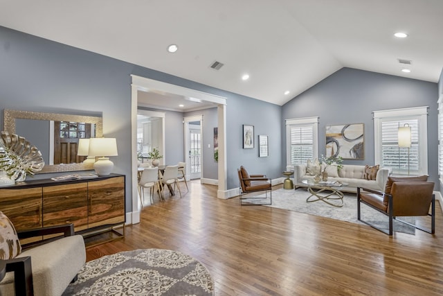 823 E 27th St, Houston, TX 77009 - living room with vaulted ceiling, wood finished floors, baseboards, and recessed lighting