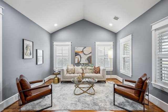823 E 27th St, Houston, TX 77009 - living room with vaulted ceiling, healthy amount of natural light, baseboards, wood finished floors, and recessed lighting