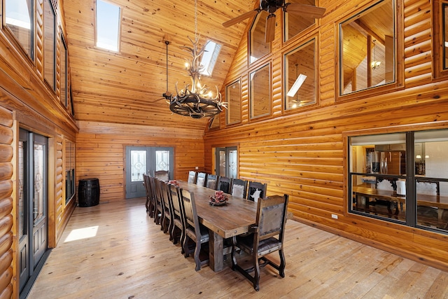 1012 Mourning Dove, Canyon Lake, TX 78133 - dining room with high vaulted ceiling, a chandelier, light wood-type flooring, a ceiling fan, and a skylight