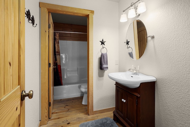1012 Mourning Dove, Canyon Lake, TX 78133 - full bath with vanity, wood finished floors, toilet, and shower / tub combo with curtain