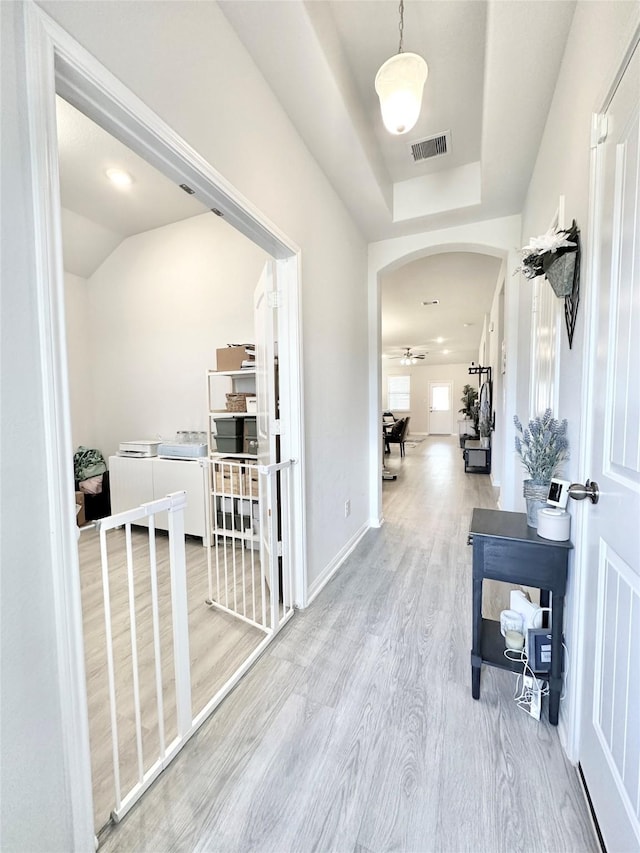 1410 Alice, Beaumont, TX 77705 - hallway featuring arched walkways, wood finished floors, baseboards, and a raised ceiling