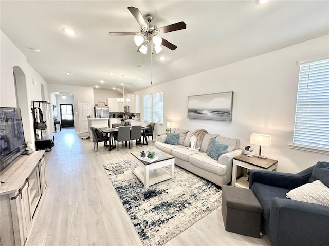 1410 Alice, Beaumont, TX 77705 - living room with a ceiling fan, light wood-style flooring, arched walkways, recessed lighting, and lofted ceiling