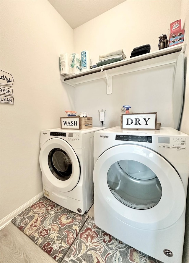 1410 Alice, Beaumont, TX 77705 - laundry room with washing machine and dryer and baseboards