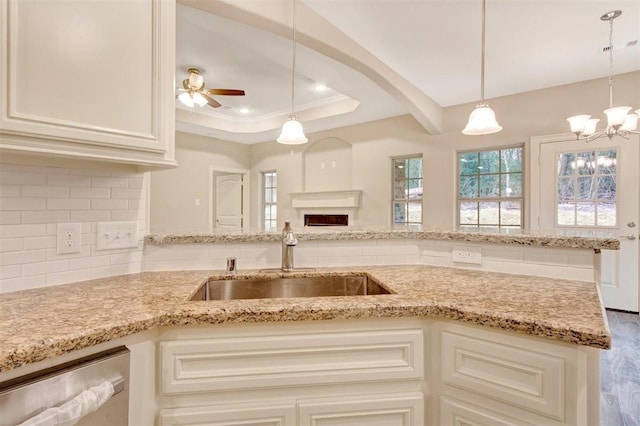 1805 Rollingwood Dr, Huntsville, TX 77340 - kitchen with a sink, backsplash, light stone countertops, and dishwasher