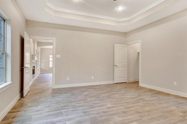 1805 Rollingwood Dr, Huntsville, TX 77340 - spare room with light wood finished floors, a tray ceiling, crown molding, baseboards, and recessed lighting