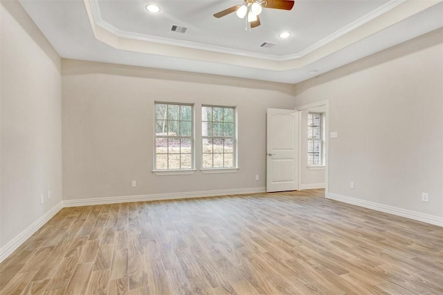1805 Rollingwood Dr, Huntsville, TX 77340 - unfurnished room featuring a ceiling fan, light wood-type flooring, a raised ceiling, crown molding, and baseboards