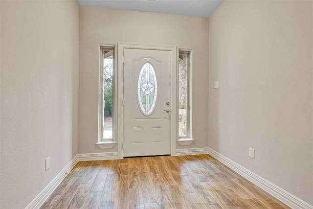 1805 Rollingwood Dr, Huntsville, TX 77340 - entryway featuring light wood-type flooring and baseboards