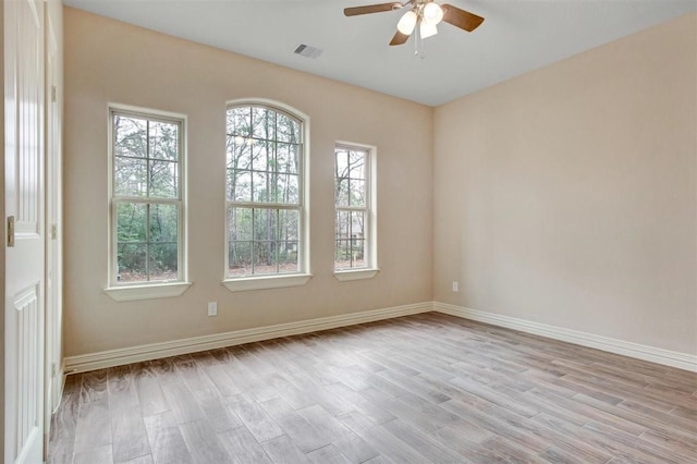 1805 Rollingwood Dr, Huntsville, TX 77340 - spare room with a ceiling fan, light wood-type flooring, and baseboards