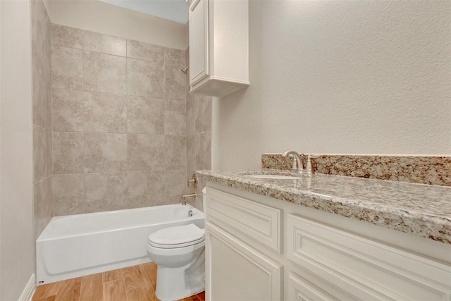 1805 Rollingwood Dr, Huntsville, TX 77340 - bathroom featuring vanity, toilet, wood finished floors, and shower / bathtub combination