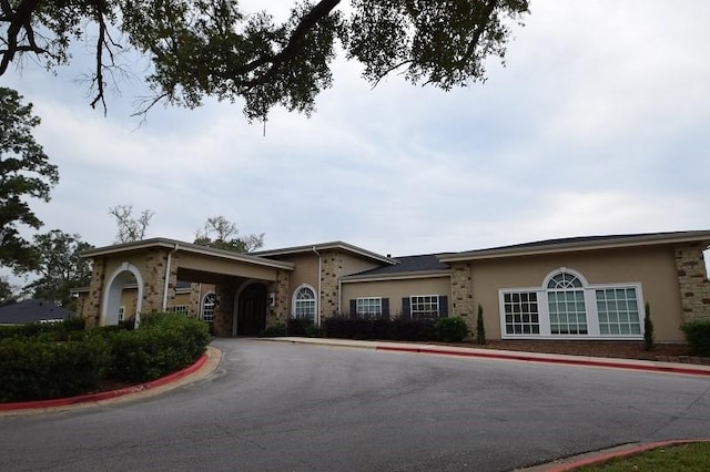1805 Rollingwood Dr, Huntsville, TX 77340 - view of front of home with stucco siding and stone siding