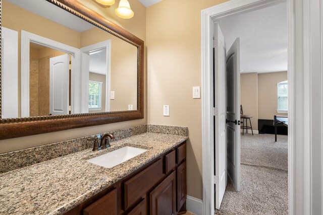 29122 Champions Dr, Magnolia, TX 77355 - bathroom featuring vanity and baseboards