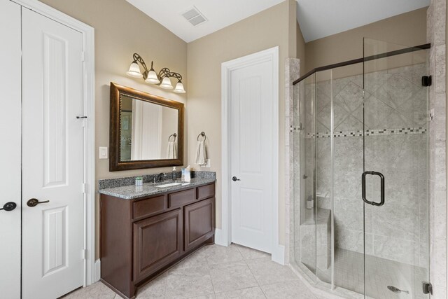 29122 Champions Dr, Magnolia, TX 77355 - full bath with vanity, a shower stall, and tile patterned floors