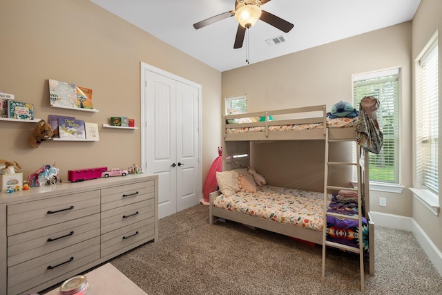 29122 Champions Dr, Magnolia, TX 77355 - carpeted bedroom with a closet, ceiling fan, and baseboards