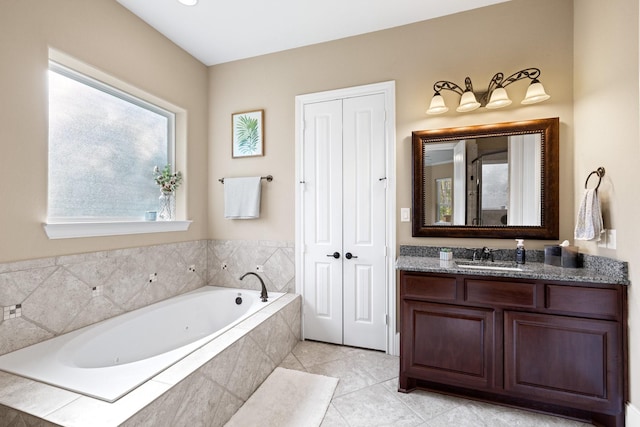29122 Champions Dr, Magnolia, TX 77355 - full bathroom featuring vanity, a jetted tub, and tile patterned floors