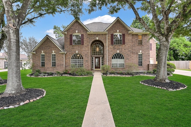 1217 Red Wing Dr, Friendswood, TX 77546 - view of front of house with brick siding and a shingled roof