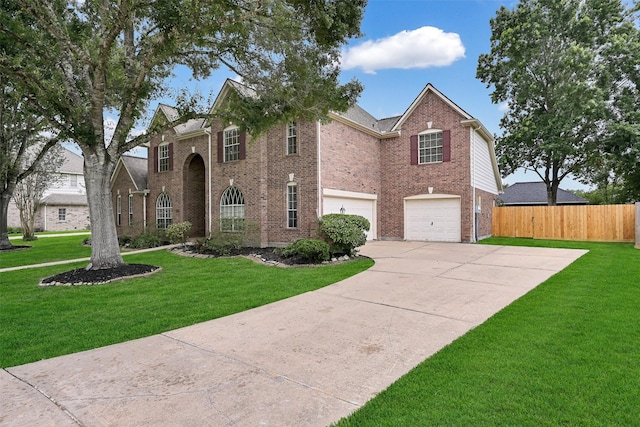 1217 Red Wing Dr, Friendswood, TX 77546 - view of front of home with brick siding, an attached garage, and driveway