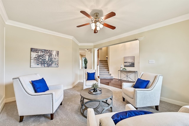 1217 Red Wing Dr, Friendswood, TX 77546 - living room with ornamental molding, a ceiling fan, baseboards, carpet, and decorative columns