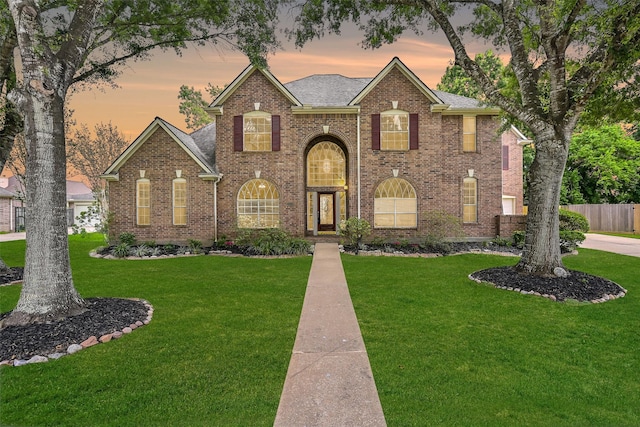 1217 Red Wing Dr, Friendswood, TX 77546 - view of front facade with brick siding and a shingled roof