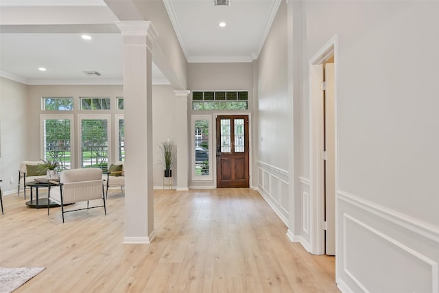 1405 Blueberry Ln, Friendswood, TX 77546 - entrance foyer with healthy amount of natural light, ornamental molding, decorative columns, light wood-style flooring, and recessed lighting