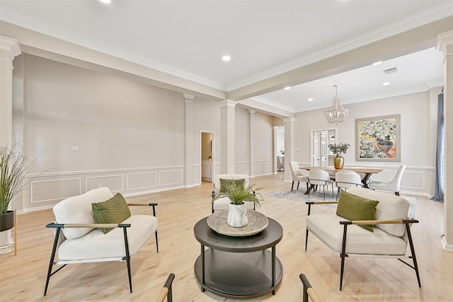 1405 Blueberry Ln, Friendswood, TX 77546 - sitting room with decorative columns, a decorative wall, light wood finished floors, recessed lighting, and ornamental molding