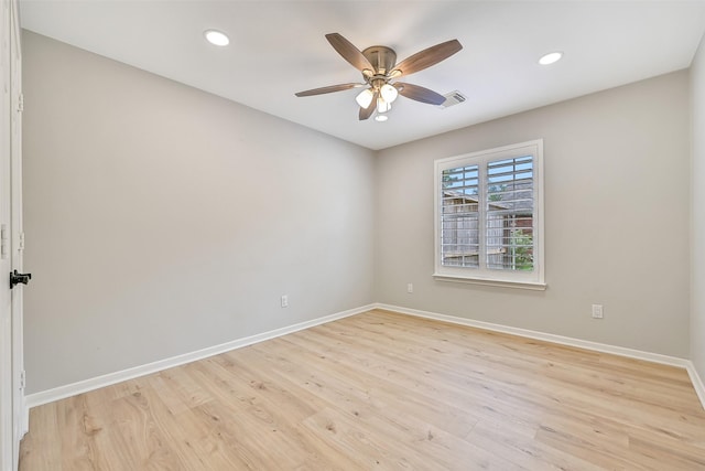 1405 Blueberry Ln, Friendswood, TX 77546 - unfurnished room featuring baseboards, a ceiling fan, light wood-style floors, and recessed lighting