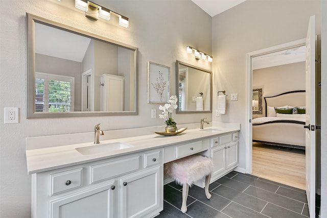 1405 Blueberry Ln, Friendswood, TX 77546 - ensuite bathroom with double vanity and tile patterned flooring