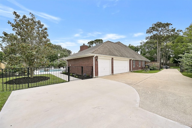 1405 Blueberry Ln, Friendswood, TX 77546 - view of side of property with brick siding, driveway, and a chimney
