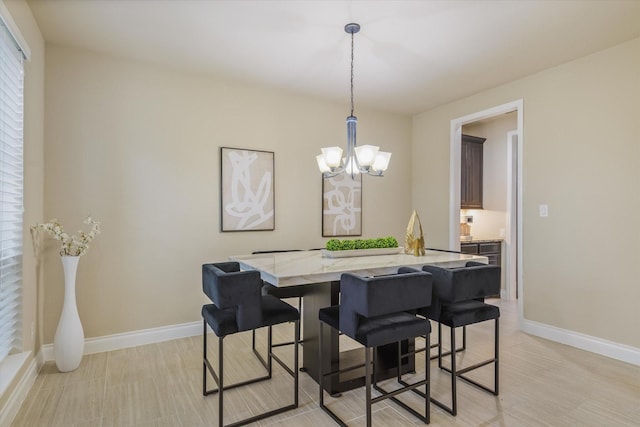 16815 Bornish Hill Ct, Humble, TX 77346 - dining area featuring a chandelier, baseboards, and light wood-type flooring