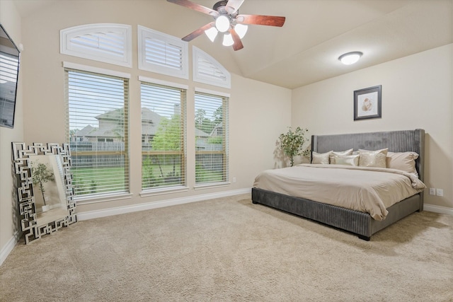 16815 Bornish Hill Ct, Humble, TX 77346 - bedroom with carpet, baseboards, vaulted ceiling, and a ceiling fan