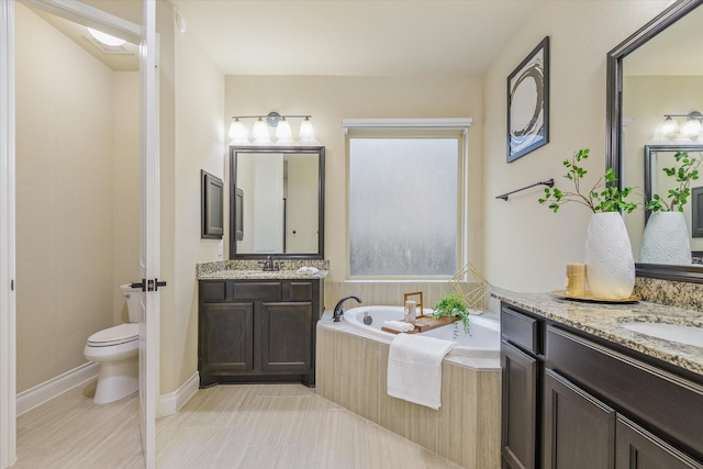 16815 Bornish Hill Ct, Humble, TX 77346 - bathroom featuring a garden tub, toilet, and two vanities