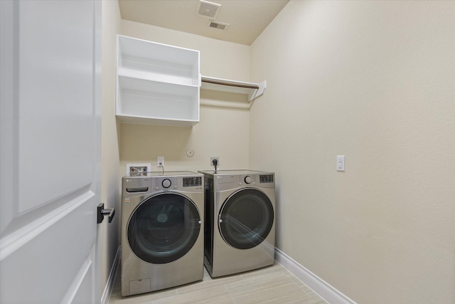 16815 Bornish Hill Ct, Humble, TX 77346 - laundry room featuring washer and dryer and baseboards