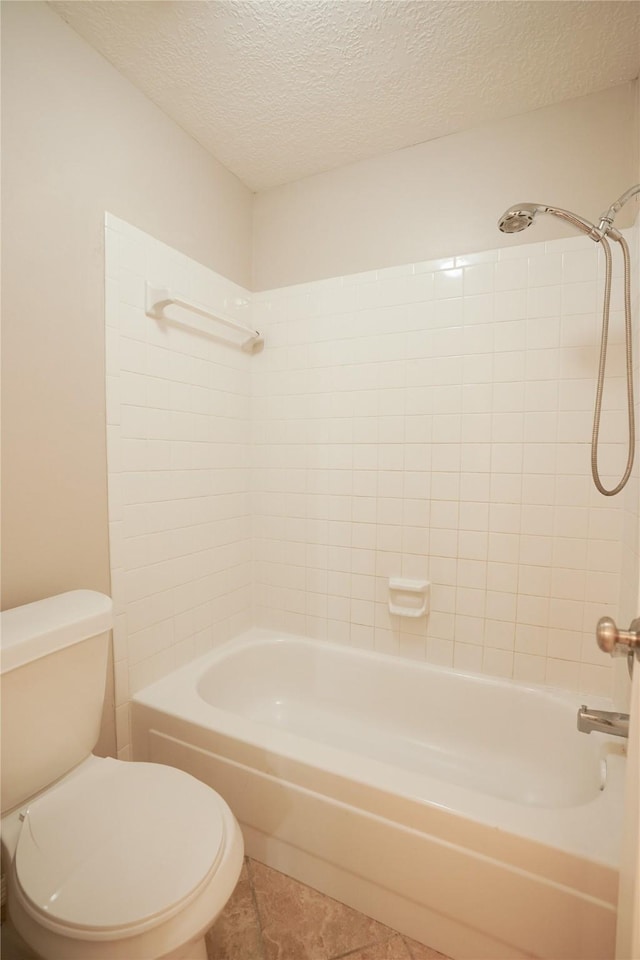 14106 Glen Canon Ln, Houston, TX 77069 - full bath featuring toilet, shower / washtub combination, a textured ceiling, and tile patterned floors