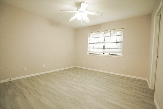 14106 Glen Canon Ln, Houston, TX 77069 - unfurnished room with light wood finished floors, baseboards, and ceiling fan